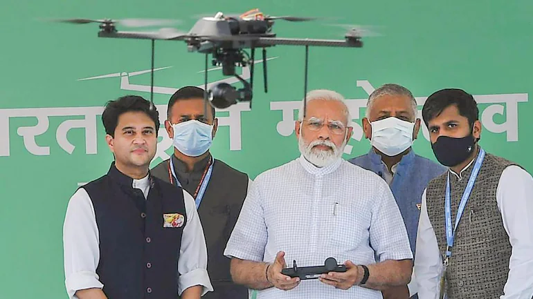 PM Modi tries his hand at flying drone at Drone Mahotsav | Watch - India  News